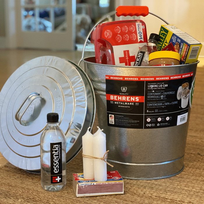 metal pail filled with emergency preparedness items