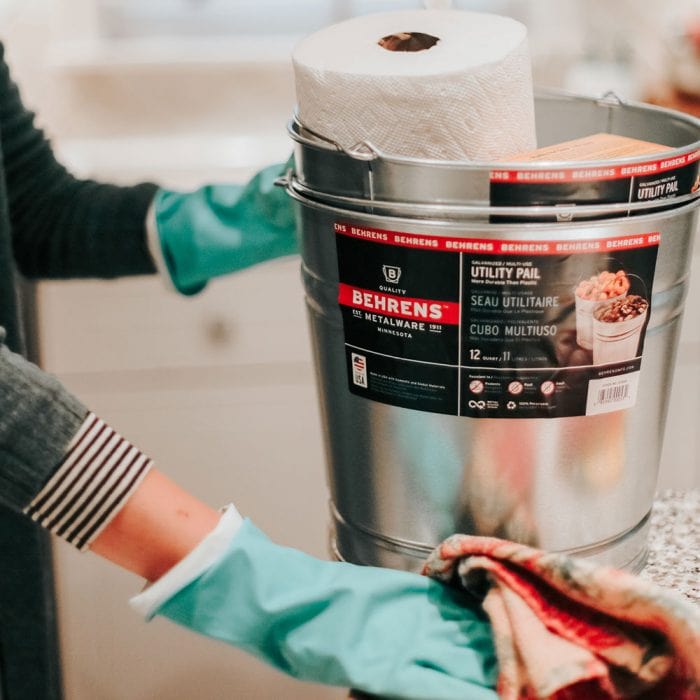 woman cleaning with a Behrens Metalware Classics Galvanized Steel Pail