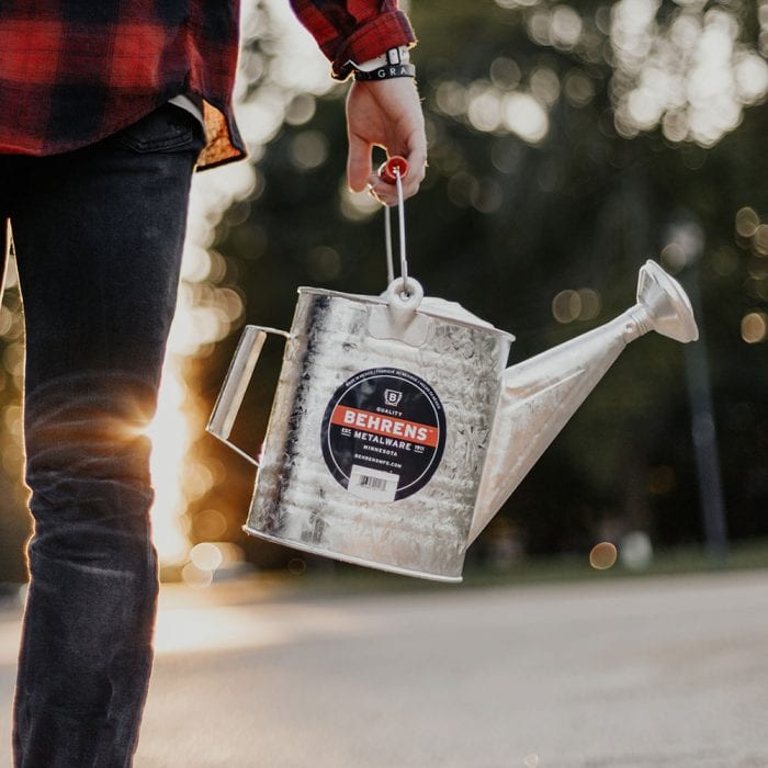 person holding a Hot Dipped Galvanized Steel Watering Can