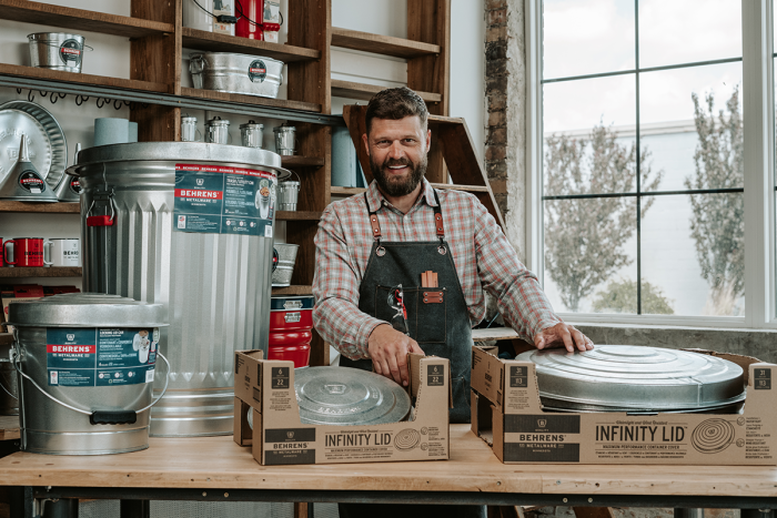 Shop owner showing the 31 gallon trash can and 6 gallon locking lid with infinity lids