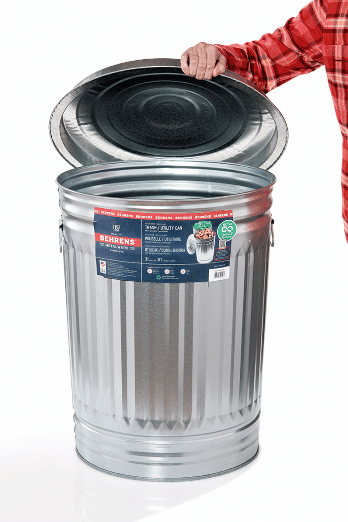 woman lift lid off of Behrens Trash Can