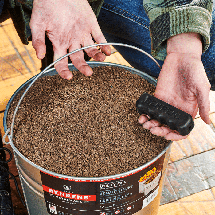 man holding back comfort grip to put on bucket handle